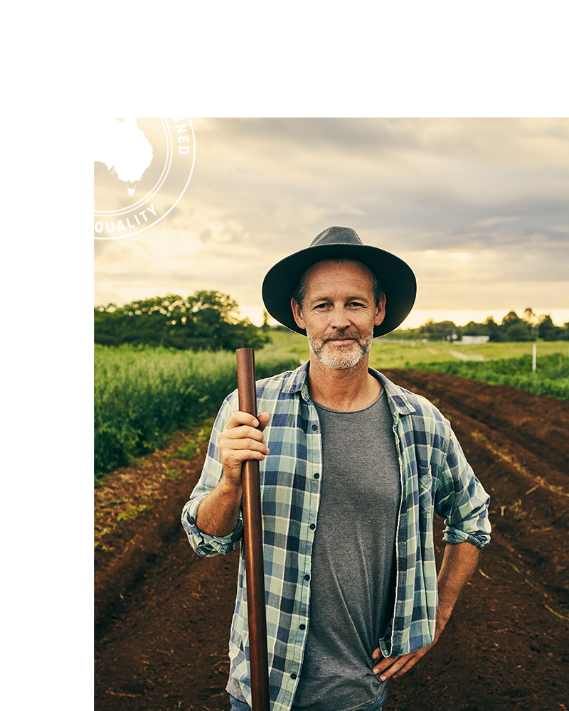 Australian Farmer in a field. Our Pan Rolls and products use only the freshest local Australian ingredients.